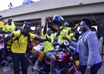 Ntume Geoffrey  displays the keys  that he had received from the State House Controller Jane Barekye who represented the President Yoweri Museveni to fulfill his pledge of the Boda -boda motorcycles  to Kingdom Kampala Boda-boda stage members at Verma house Lugogo bypass on 20th September 2022. Photo by PPU/Tony Rujuta.