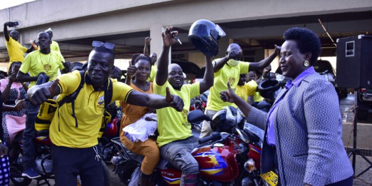 Ntume Geoffrey  displays the keys  that he had received from the State House Controller Jane Barekye who represented the President Yoweri Museveni to fulfill his pledge of the Boda -boda motorcycles  to Kingdom Kampala Boda-boda stage members at Verma house Lugogo bypass on 20th September 2022. Photo by PPU/Tony Rujuta.