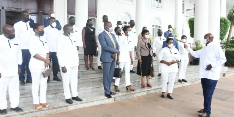 President Museveni in a group photo with Minister Haruna Kasolo and other Emyooga stakeholders