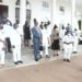 President Museveni in a group photo with Minister Haruna Kasolo and other Emyooga stakeholders