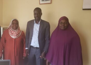 Trevor Solomon Baleke and Wante Muslim SS Headmistress Khadija  Nakimwero (R) pose for a photo in the latter's office after addressing the parents