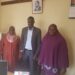 Trevor Solomon Baleke and Wante Muslim SS Headmistress Khadija  Nakimwero (R) pose for a photo in the latter's office after addressing the parents