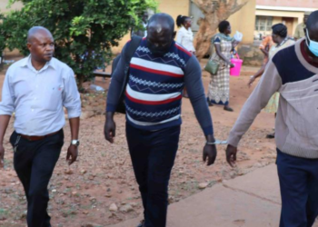 Ogwang and Otike at Lira central police station