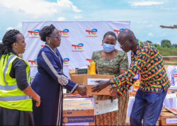 Mariam Nampeera Mbowa (2R), Deputy General Manager, TotalEnergies EP Uganda and guest of honour Buliisa launch while officiating at the handover of Start-up Kits to Project Affected Persons (PAPs)