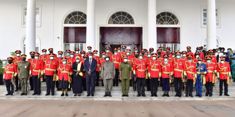 President Museveni (C) poses for a photo with UPDF generals who retired from the army during a function at State House Entebbe. PPU Photo