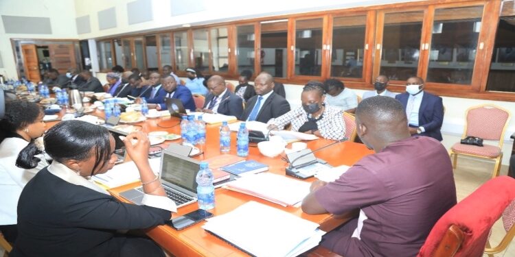 The Uganda Airlines Top Management Team led by the CEO seated to the right of Hon. Ssenyonyi (R) responding to queries