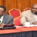 Prof. Waswa Balunywa (L) and a colleague appearing before the Public Accounts Committee