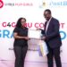 Post Bank Uganda CEO Julius Kakeeto hands over a special plaque and gift to Esther Bwaku for her outstanding role the Girls for Girls second cohort Leader and Chief Mobiliser in the Bank.