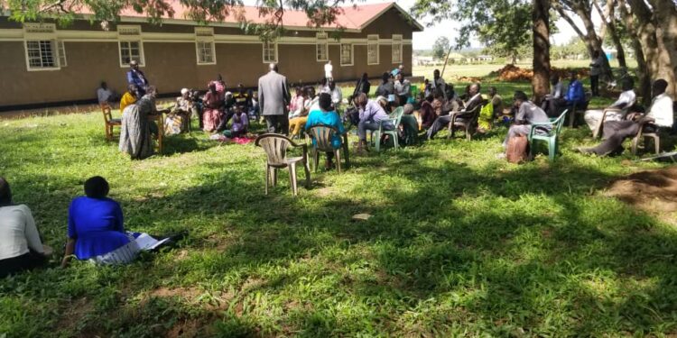 RDC Adiama with his deputy Odongo in a meeting with PWD leaders