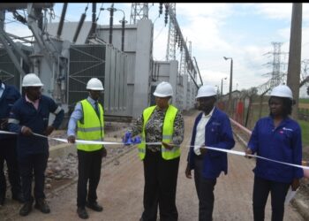 The Managing Director of Eskom Uganda Ms Thozama Gangi(centre) join by departmental heads during the commissioning the three generator transformers behind on Thursday.PHOTO BY ANDREW ALIBAKU