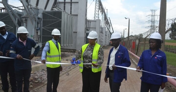 The Managing Director of Eskom Uganda Ms Thozama Gangi(centre) join by departmental heads during the commissioning the three generator transformers behind on Thursday.PHOTO BY ANDREW ALIBAKU