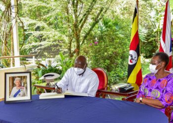 President Yoweri Museveni writing in the condolence book as the First Lady/Ministry of Education and Sports Janet Museveni looks on as he pays his tribute to the fallen Queen of United Kingdom  Elizabeth II at the  British High Commissioner’s residence in Nakasero Kampala on 12th September 2022. Photo by PPU/ Tony Rujuta.