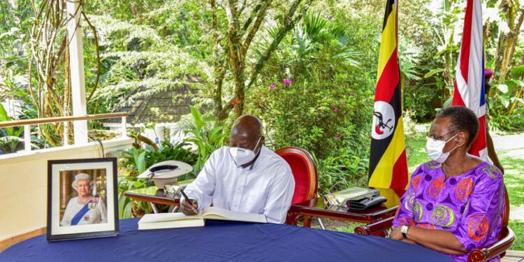 President Yoweri Museveni writing in the condolence book as the First Lady/Ministry of Education and Sports Janet Museveni looks on as he pays his tribute to the fallen Queen of United Kingdom  Elizabeth II at the  British High Commissioner’s residence in Nakasero Kampala on 12th September 2022. Photo by PPU/ Tony Rujuta.