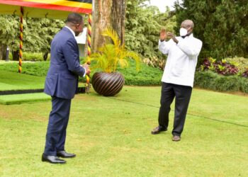 President Yoweri Museveni sees off the out-going French Ambassador to Uganda H.E Jules-Armand Aniambossou as he bids farewell to the President after concluding his duty in Uganda at the State House Entebbe on 17th October 2022. Photo by PPU/ Tony Rujuta.