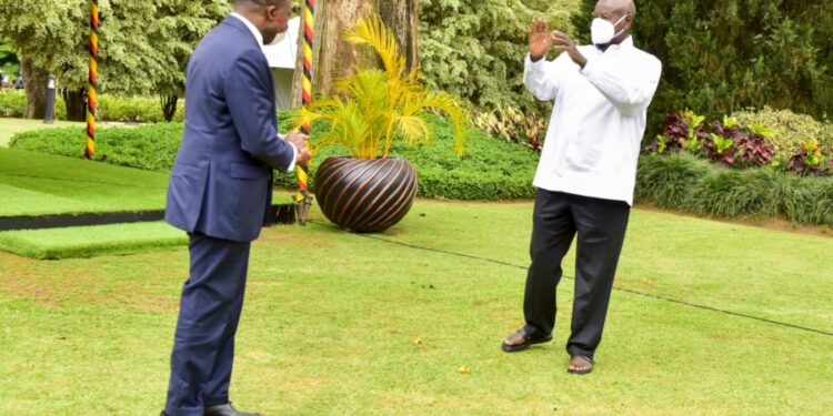 President Yoweri Museveni sees off the out-going French Ambassador to Uganda H.E Jules-Armand Aniambossou as he bids farewell to the President after concluding his duty in Uganda at the State House Entebbe on 17th October 2022. Photo by PPU/ Tony Rujuta.