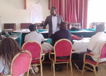 Alfred Besigensi speaking to journalists