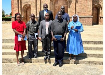 Msgr. Castro Adeti, Vicar General of Aura Diocese, representing the Bishop, Cente-Tech CEO Dr Grace Ssekakubo and others pose for a picture (Location: Arua District)