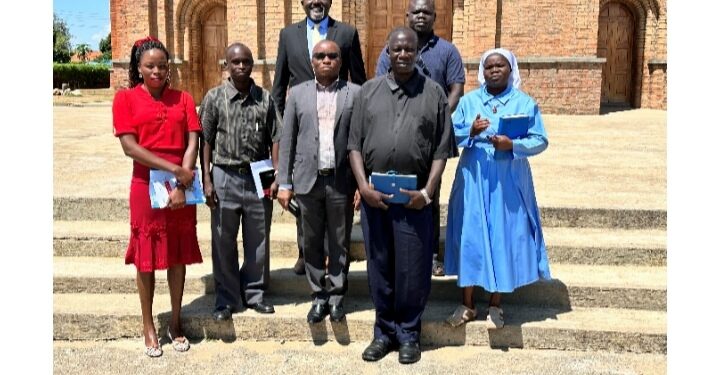 Msgr. Castro Adeti, Vicar General of Aura Diocese, representing the Bishop, Cente-Tech CEO Dr Grace Ssekakubo and others pose for a picture (Location: Arua District)