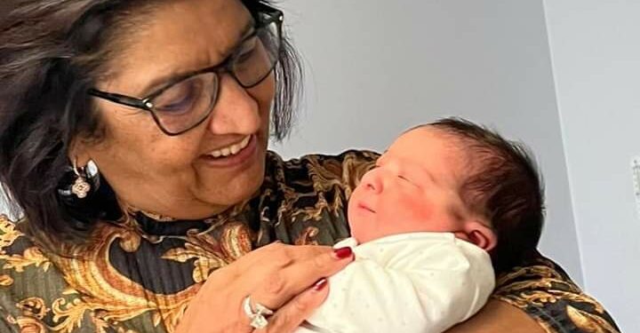 Mrs Jyotsna Ruparelia with her grandchild