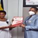 Speaker Among (R) receives the report from IGG Beti Kamya at Parliament