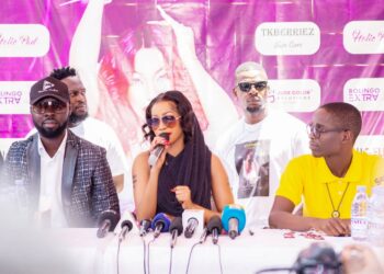 Maestro Studios Donald Wasake putting on cap alongside Diva Sheebah Karungi and other partners during the press launch of her concert recently
