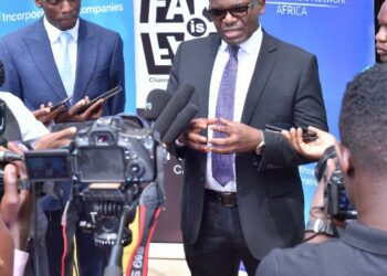 URSB Intellectual Property Director Gilbert Agaba (left) and ACN Legal and Corporate affairs Director Counsel Fred Muwema (right) talk to the press at the sidelines of the dialogue.