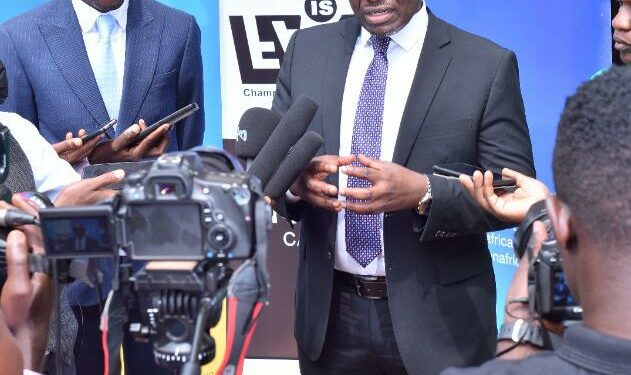 URSB Intellectual Property Director Gilbert Agaba (left) and ACN Legal and Corporate affairs Director Counsel Fred Muwema (right) talk to the press at the sidelines of the dialogue.