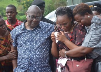 Minister Mayanja and family during their daughter's burial