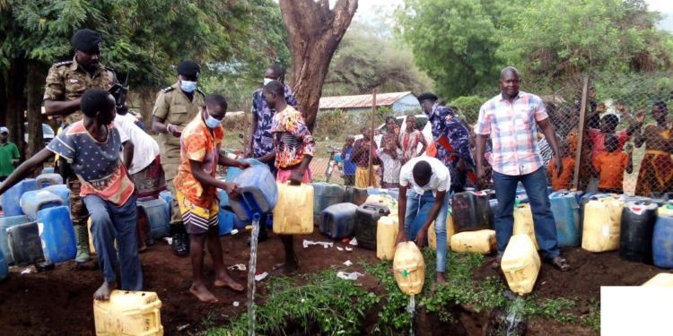 Police and locals pouring crude waragi at Moroto CPS