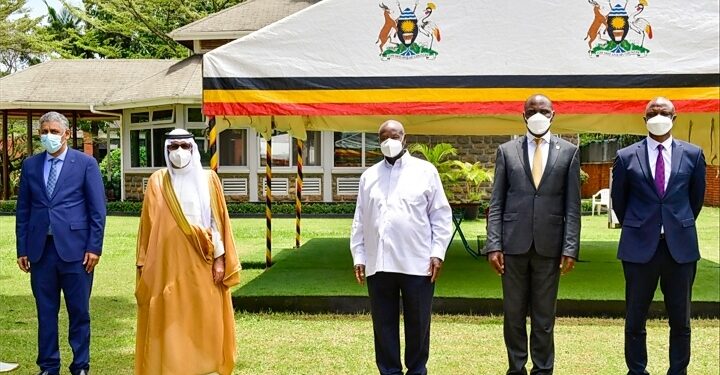 President Museveni poses for a photo with Dr. Fahad Abdullah Al- Dossari (2nd L) Chairman of Board of Directors of BADEA and other officials