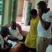 Seith Kansiime centre, and other members at Hotel Emlad Kampala