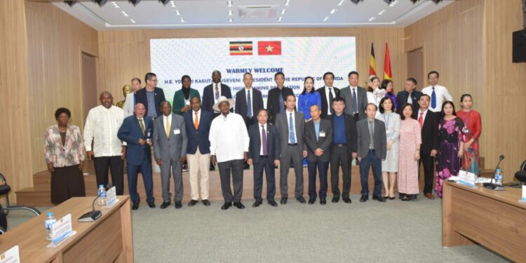 President Yoweri Museveni  in a group photo after a meeting with staff at the Vietnam Academy of Agricultural Sciences in Hanoi, Vietnam on 25th November 2022. Photo by PPU/Tony Rujuta.