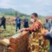 Minister Babalanda laying a foundation for the construction of Bufumbira SDA Secondary School A'level classroom block