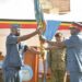 The outgoing CAF Lt Gen Charles Lutaaya (L) handing over the UPDF – Air Force service Flag to the new CAF Lt Gen Charles Okidi (R)