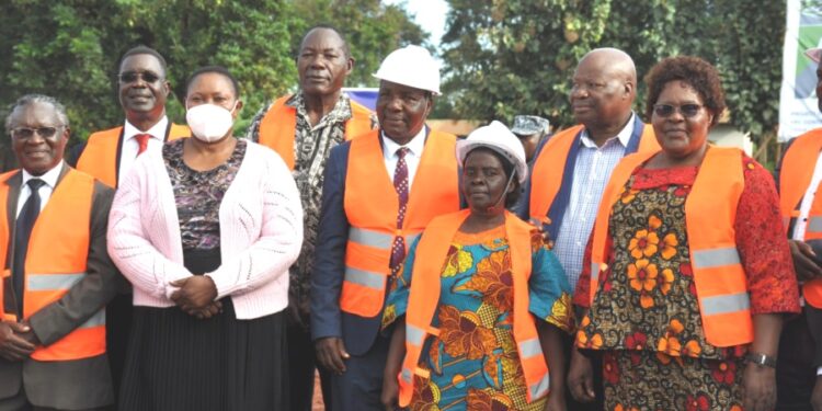 Minister Babalanda with board members of Maganjo Grain Millers Ltd