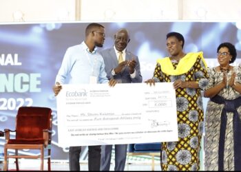 Uganda’s EAC Presidential Innovative Award winner Steven Kakooza receives his award from Uganda’s Vice President Jessica Alupo for his innovation Kawu Smart Card at the East African Youth Innovation Forum held in Kololo, Kampala.