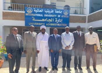 Amb. Ssemuddu with officials at International University of Africa