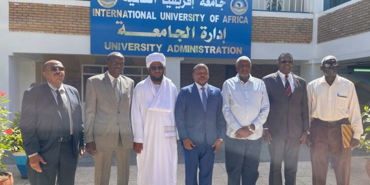 Amb. Ssemuddu with officials at International University of Africa