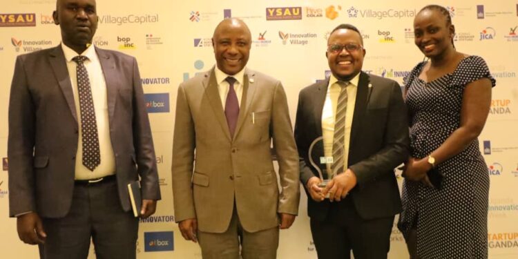 L-R- URSB Deputy Registrar General, Alex Anganya, State Minister for National Guidance at the Ministry of ICT and National Guidance, Hon. Kabbyanga Godfrey Baluku, Steven Baryevuga & Provia Nangobi in a group picture during the award ceremony