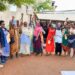 The State House Political desk Princess Pauline Nassolo (left) and Flora Kabibi (second left) in a group photo with very excited women from Bukoloto market while talking to them on how to embrace government programs in Kayunga district on 9th December 2022. Photo by PPU/ Tony Rujuta.