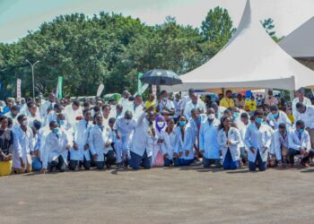 Medical workers kneeling down to thank the President during the Youth Symposium at Kololo ceremonial grounds on 3rd December 2022. Photo by PPU/Tony Rujuta.