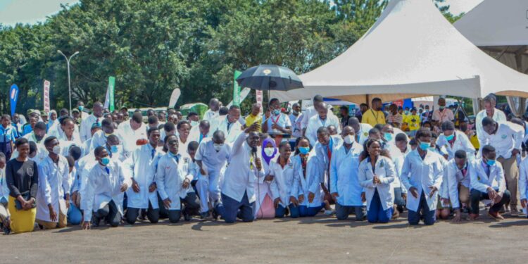 Medical workers kneeling down to thank the President during the Youth Symposium at Kololo ceremonial grounds on 3rd December 2022. Photo by PPU/Tony Rujuta.