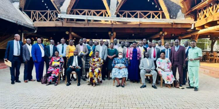 Minister Babalanda in a group photo with the RDCs, RCCs,  their deputies, DISOs, RDC Secretariat and Office of the President Officials at Bomah Hotel, Gulu City (Photo- MOPPU)