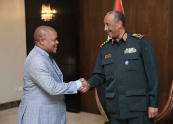 Gen. Al Burhan welcomes Ambassador Ssemuddu to the meeting convened at the Presidential Palace in 
Khartoum, Republic of Sudan on the side-lines of the 48th IGAD Council of Ministers’ meeting. Courtesy photo