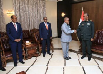 Gen. Al Burhan welcomes Ambassador Ssemuddu to the meeting convened at the Presidential Palace 
in Khartoum, while the foreign Ministers of Djibouti (right) and Ethiopia (2nd left) look on.