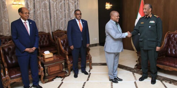 Gen. Al Burhan welcomes Ambassador Ssemuddu to the meeting convened at the Presidential Palace 
in Khartoum, while the foreign Ministers of Djibouti (right) and Ethiopia (2nd left) look on. (File photo)