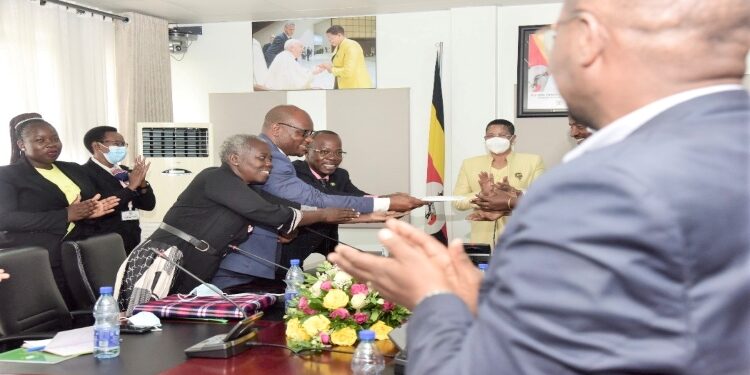 Speaker Anita Among (far-right) receiving the petition for a palliative care policy from the Palliative Care Association of Uganda