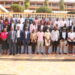 URSB Deputy Registrar General, Alex Anganya (2nd L) in a group picture with Tier IV Non Deposit Taking Institutions Representatives at Hotel Africana in Kampala.