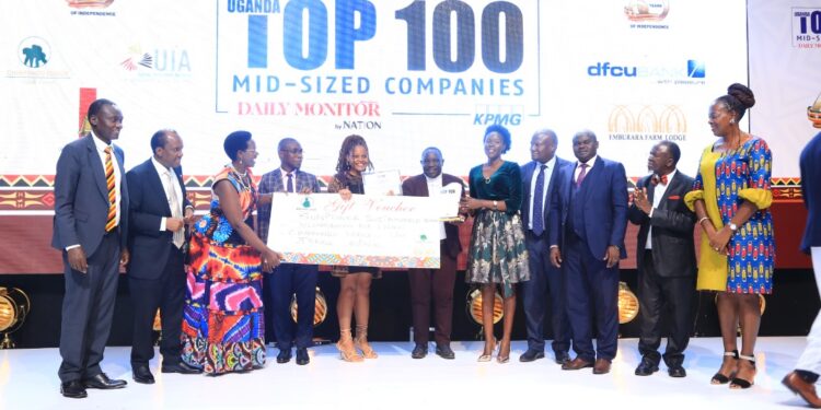 Winners pose with the invited guests at teh Top 100 Gala Dinner
