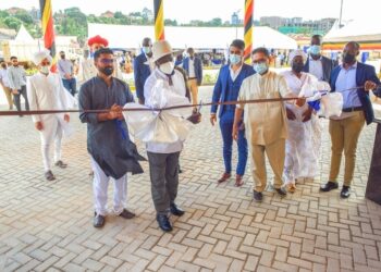 President Yoweri Museveni cuts the tape as a symbol that the school as been opened During the grand opening of the Shree Sahajanand School in Bukoto, Kampala on the 3rd December 2022. Photo by PPU/Tony Rujuta.